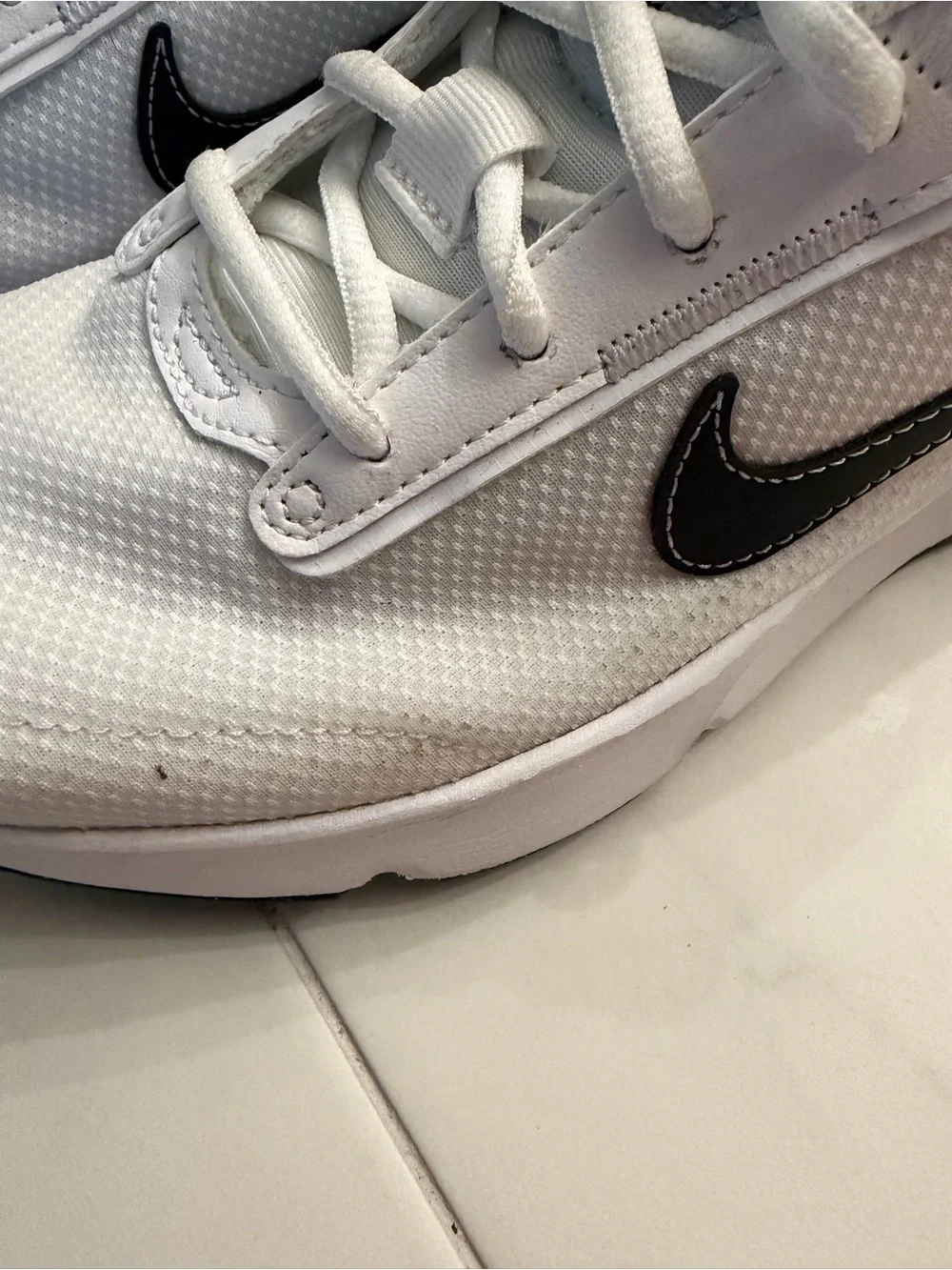Nike White Sneakers with Black Swoosh and Gray Pull Tabs